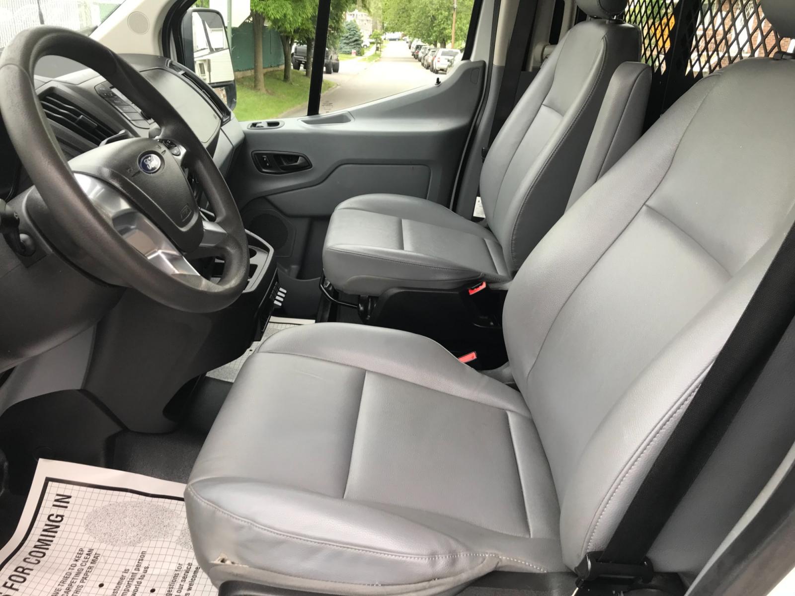 2018 White /Gray Ford Transit 150 (1FTYE1YM1JK) with an 3.7 V6 engine, Automatic transmission, located at 577 Chester Pike, Prospect Park, PA, 19076, (610) 237-1015, 39.886154, -75.302338 - 2018 Ford Transit 150: Dual drop down ladder racks, multiple pieces of shelving, power inverter w/ outlet, heavy duty partition, FLEET MAINTAINED, runs LIKE NEW! This vehicle comes inspected and has been given a bumper to bumper safety check. It is very clean, reliable, and well maintained. We of - Photo #9